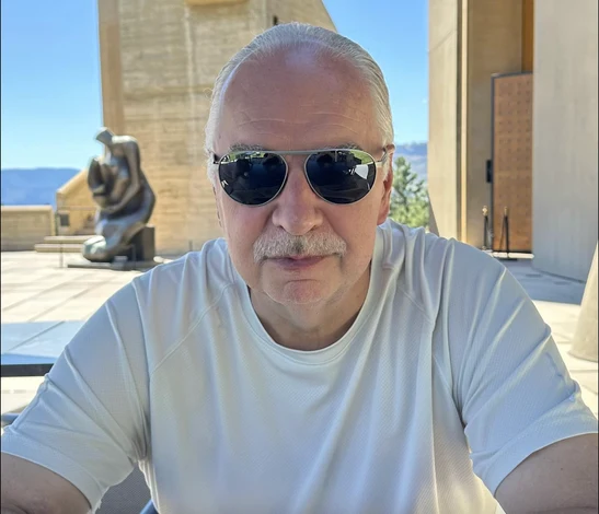 Portrait of KFS strategic partner and producer Michael Porter wearing sunglasses