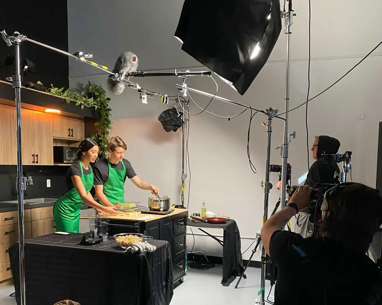 Camera, lighting and sound crew working on a production setup