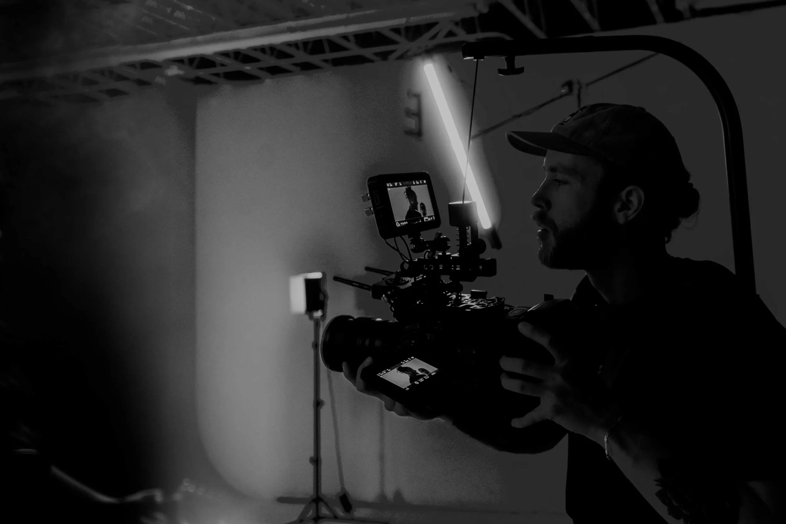 James Alton operating a compact camera setup on set