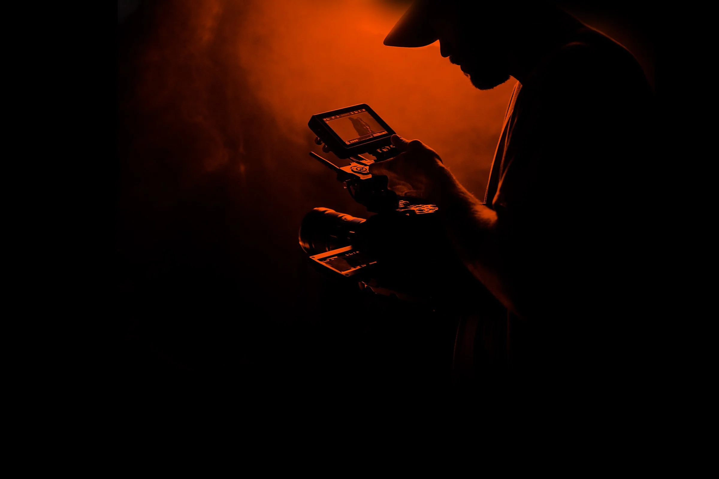 Camera operator reviewing a shot on a production monitor