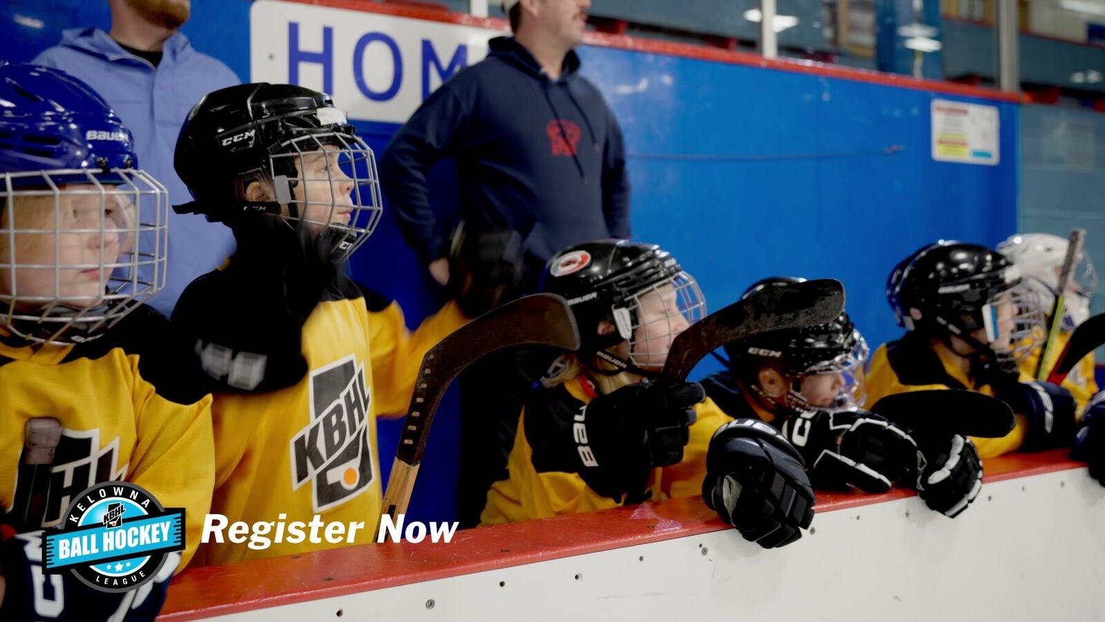 Kelowna Ball Hockey players on the bench in a finished campaign frame
