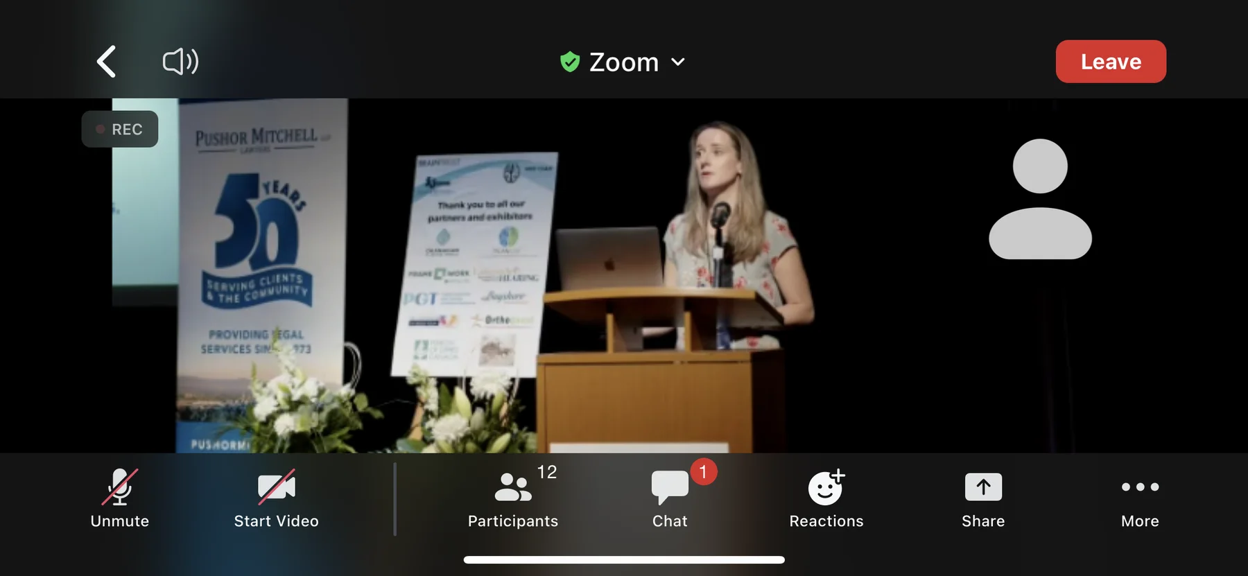 Zoom view of a BrainTrust Canada conference speaker at the podium