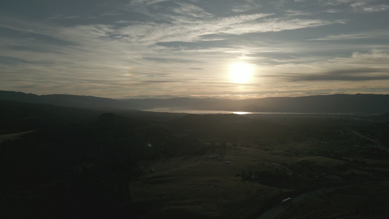 Aerial view over Kelowna, Okanagan Lake and surrounding roads