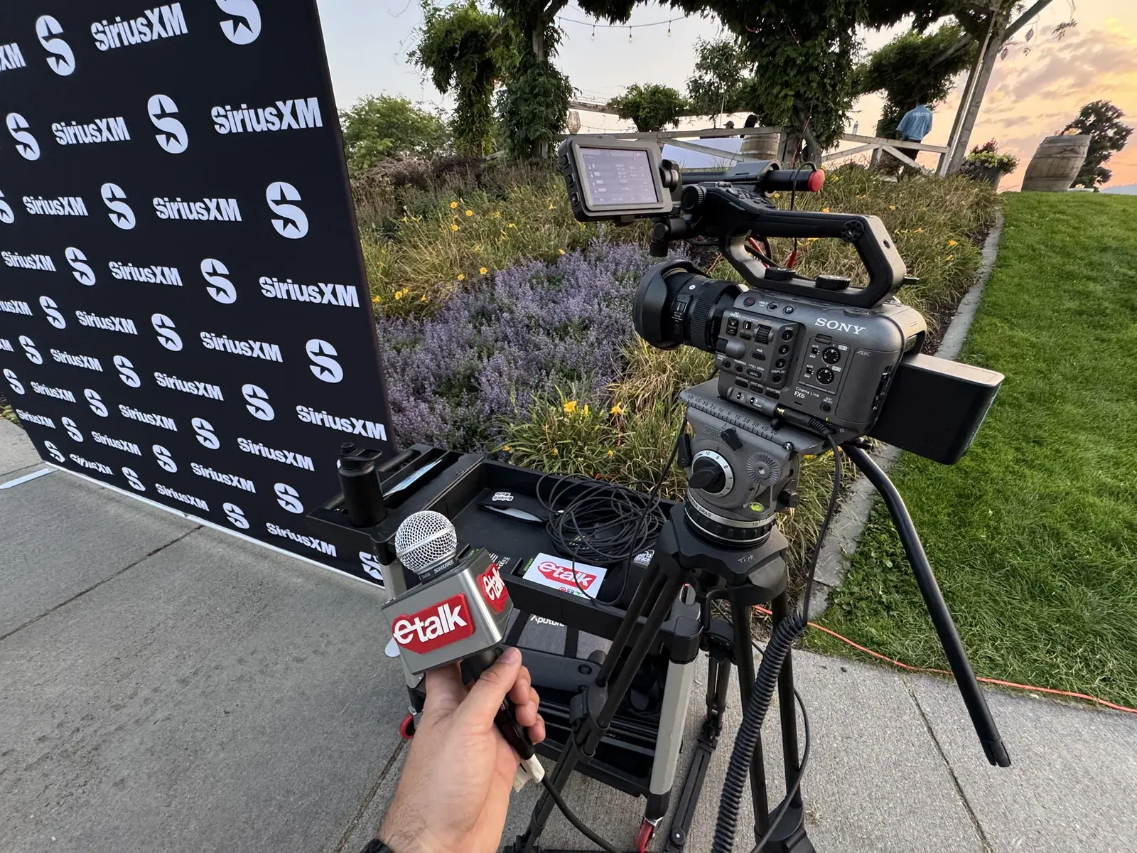 Sony FX6 camera and eTalk microphone beside a SiriusXM backdrop during Canadian Country Music Week