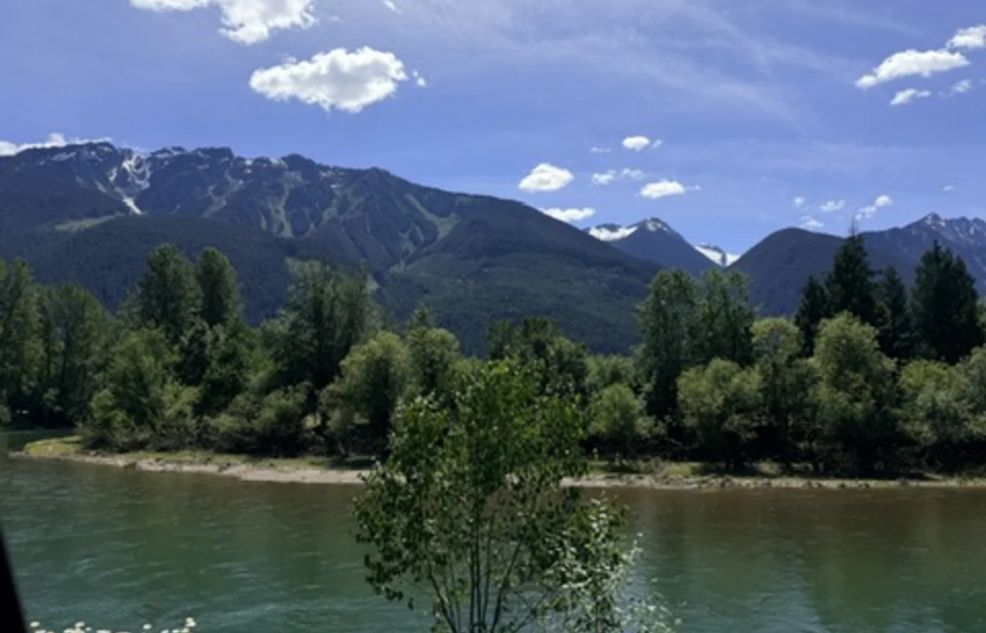 River and mountain field photograph from Displaced