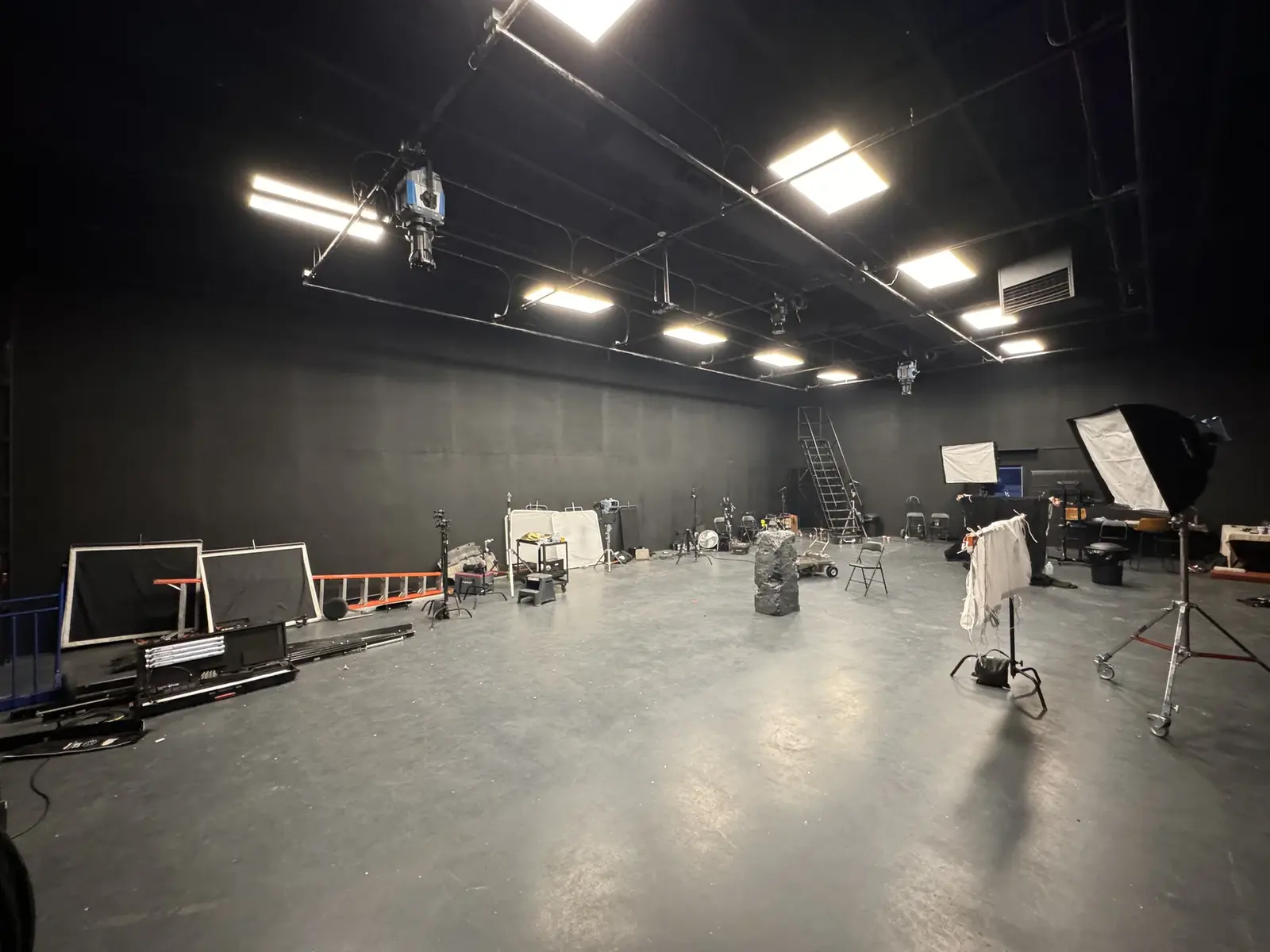 Wide iPhone BTS view of The Keepers stage build inside the former Kelowna Film Studios space