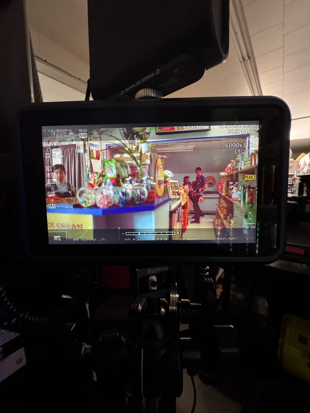 Camera monitor showing The Knitting Diaries convenience-store frame