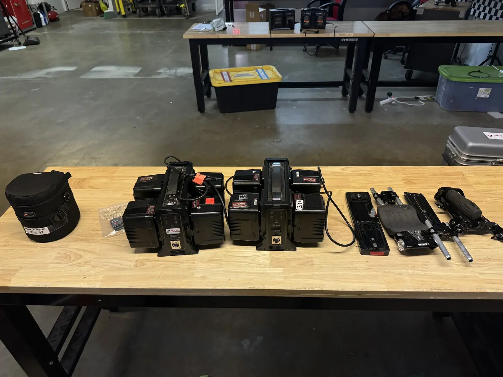 Camera power and support gear laid out on a prep table before the NVIDIA SIGGRAPH support day