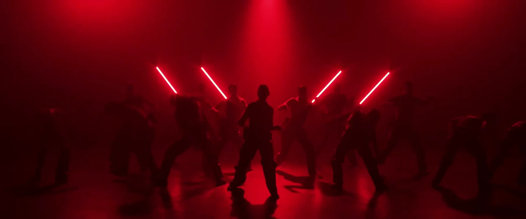 Sockeye ensemble crossing through red light and haze in the 2024 film