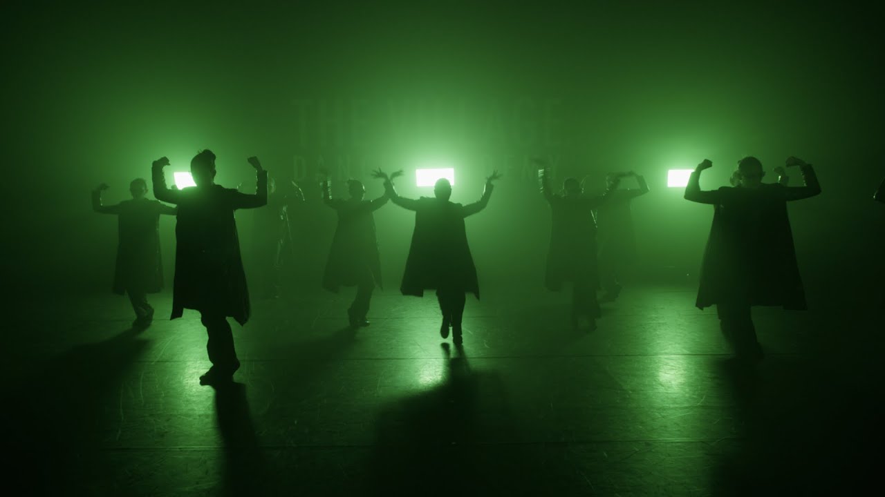 Sockeye ensemble performing in green backlight and haze