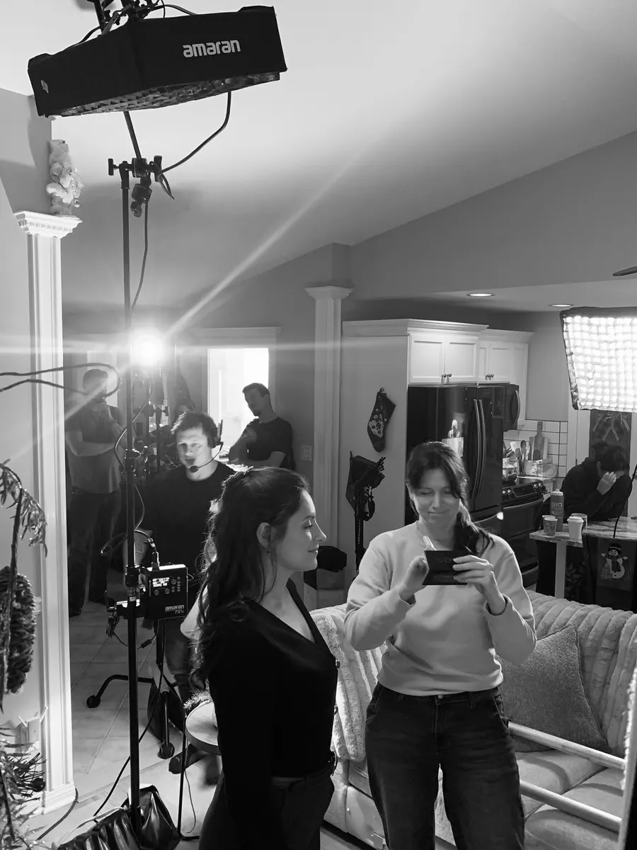 Wide behind-the-scenes view of crew, lighting and camera during The Letter production