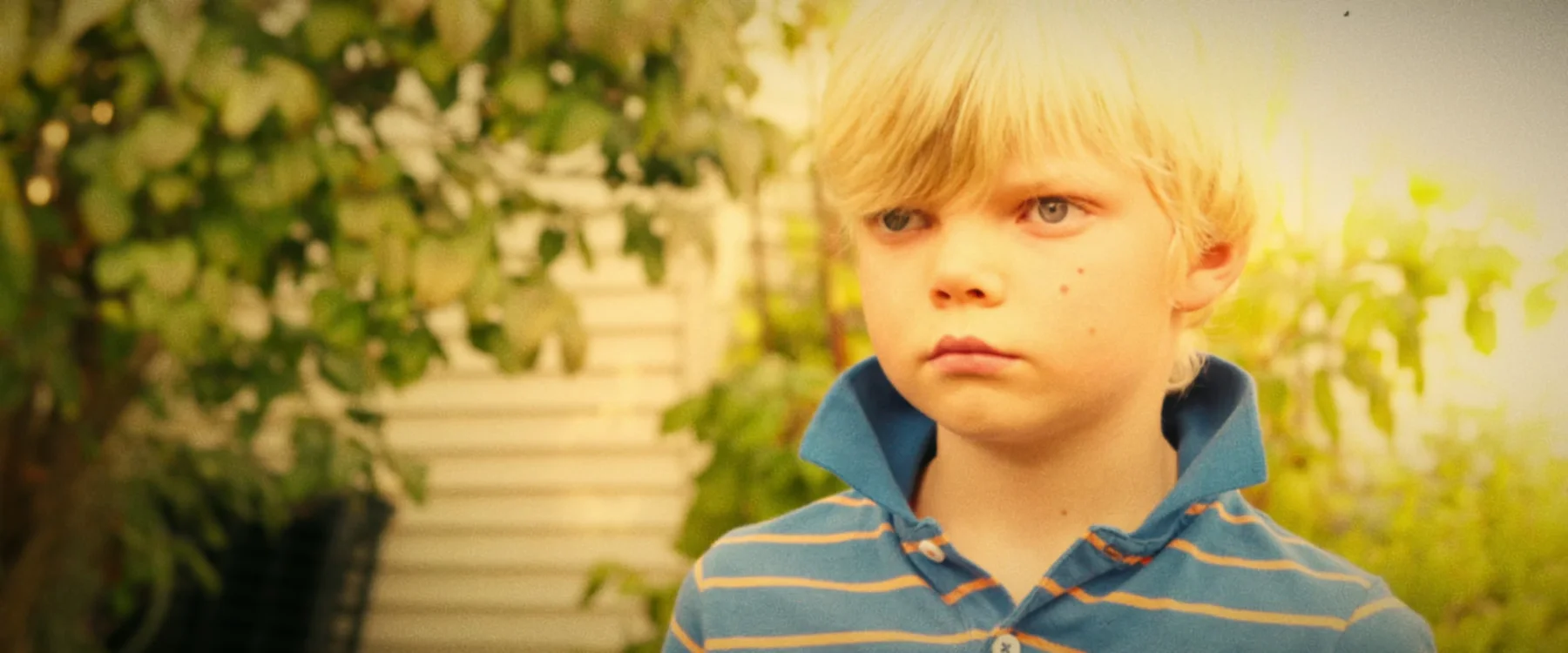 Young Dave watches from the garden in a finished frame from Three Hearts