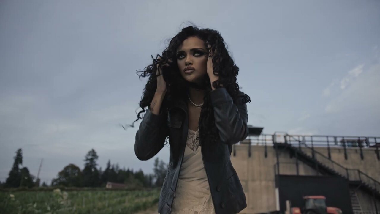 Alexandra Wright performs outdoors in a finished frame from the Colorado music video